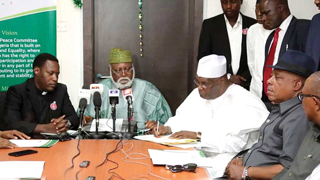 Buhari, Atiku Abubakar, Oby Ezekwesili sign peace pact