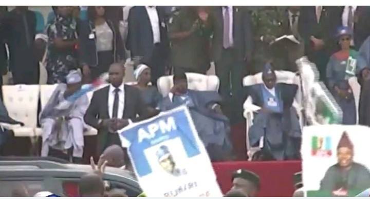 Tinubu denies flinging APC flag despite being caught on video