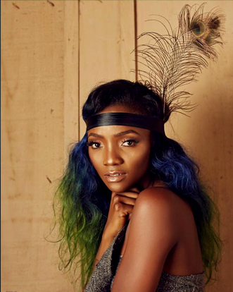 The world is laughing at us – singer, Simi slams internet fraudsters