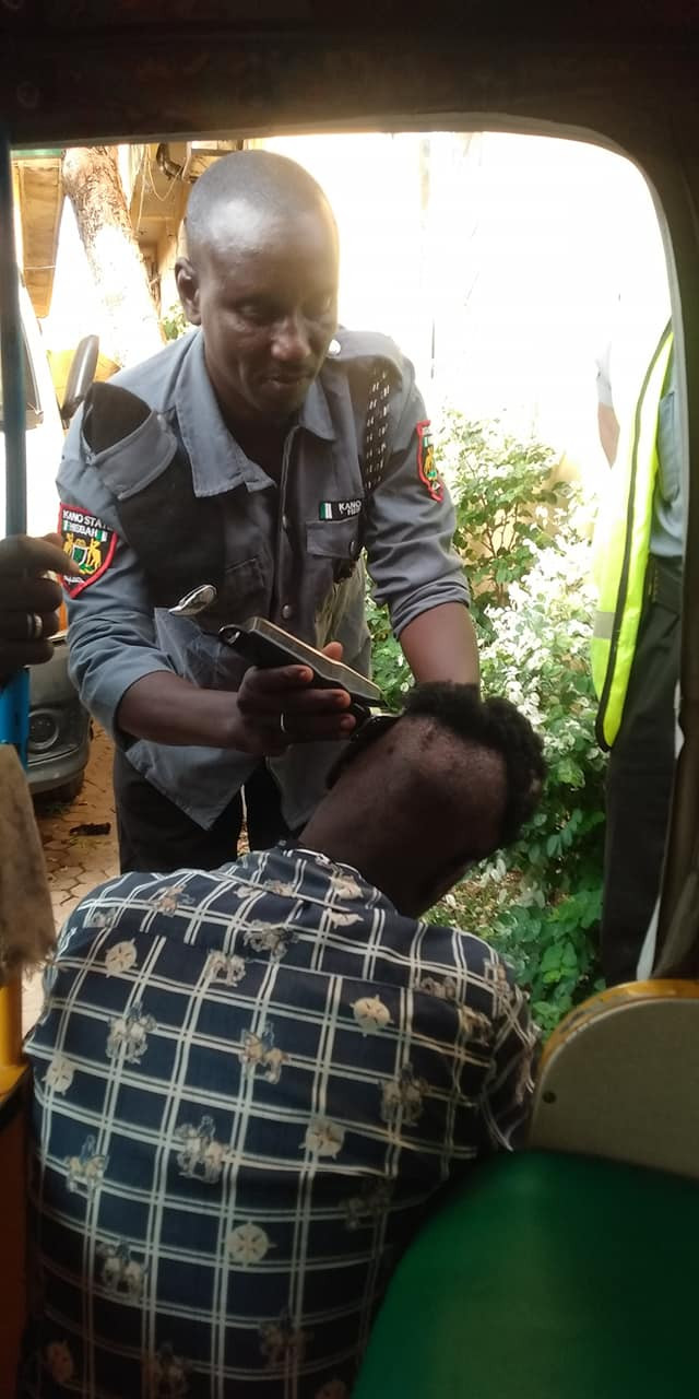 Photos: Sharia police in Kano shave young men’s hair, arrest drivers for adorning their tricycles with Davido, Naira Marley’s photos